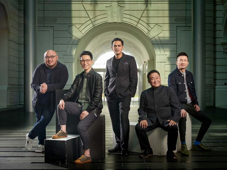 Five Singapore theatre directors photographed together in a vaulted heritage corridor