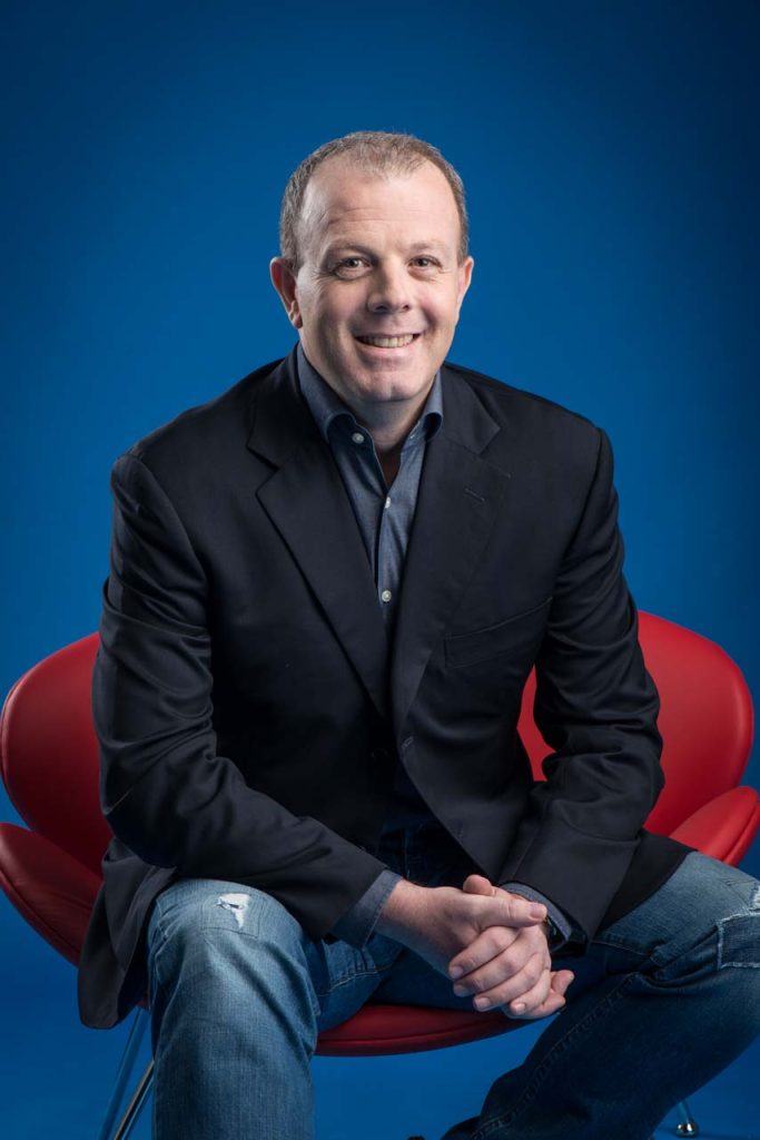 Second corporate portrait of Brett Conway seated in a red chair — singapore corporate portrait photography, corporate portrait photographer singapore