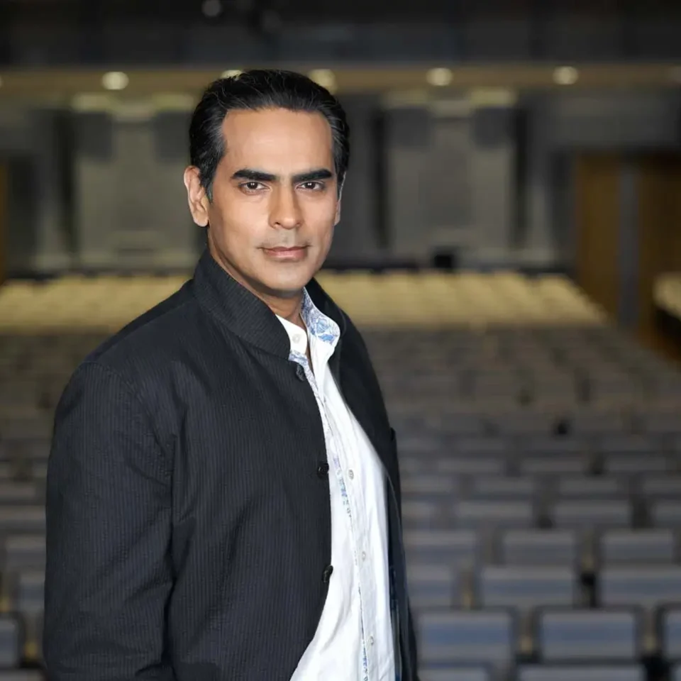 Gaurav Kripalani standing in the Victoria Concert Hall auditorium — environmental portrait photographer singapore, on location corporate portrait singapore