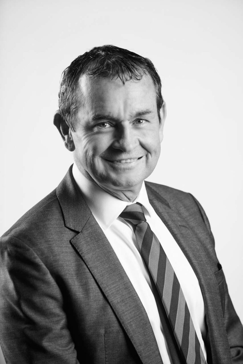Black and white corporate portrait of a Dell Technologies executive in a dark suit and tie — singapore C-suite portrait photography, singapore CEO corporate photographer