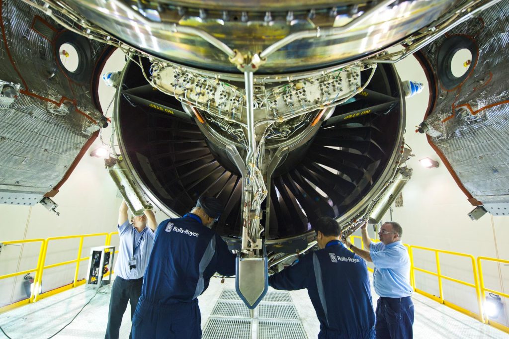 this corporate branding photography captures Rolls-Royce engineer working on a highly intricate part. the image emphasizes the detail and skill that goes into every task, reflecting the company’s reputation for precision and quality.