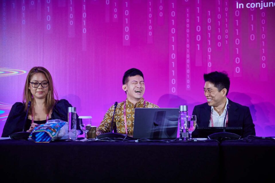 Three panellists seated on stage at the IAPP Asia Privacy Forum 2024 — singapore corporate events photographer, professional corporate events photography singapore