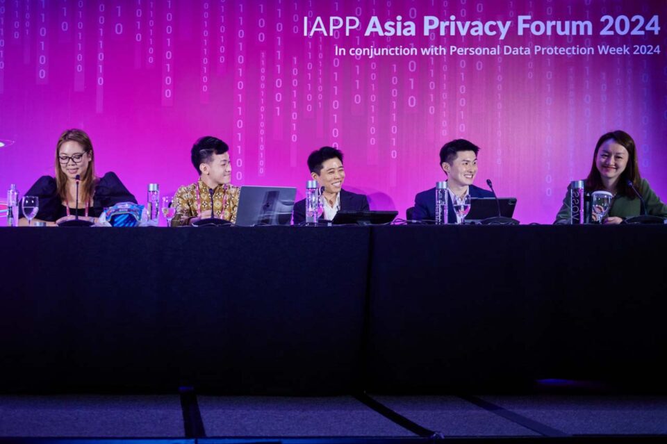Four panellists at the table on stage at the IAPP Asia Privacy Forum 2024 — singapore corporate events photographer, professional corporate events photography singapore