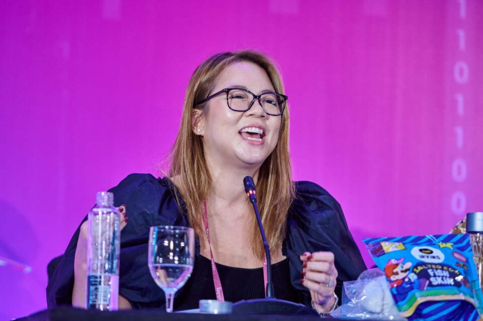 Speaker presenting animatedly against the magenta forum backdrop at the IAPP Asia Privacy Forum 2024 — singapore corporate events photographer