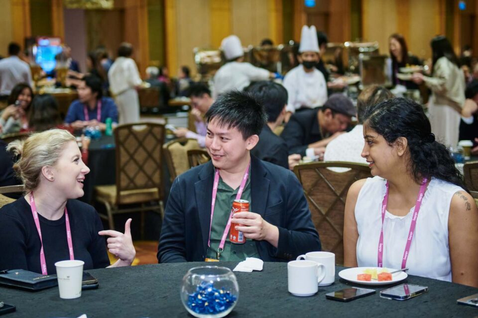 Delegates seated at round tables with refreshments at the IAPP Asia Privacy Forum 2024 — singapore corporate events photographer, professional corporate events photography singapore