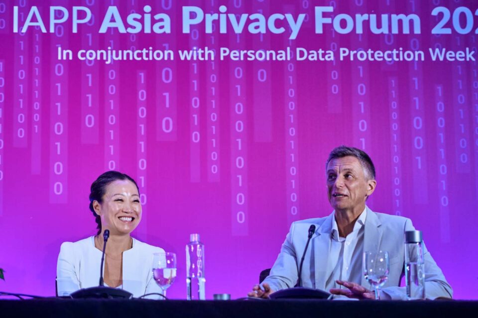 Panel on stage beneath the Personal Data Protection Week backdrop at the IAPP Asia Privacy Forum 2024 — singapore corporate events photographer
