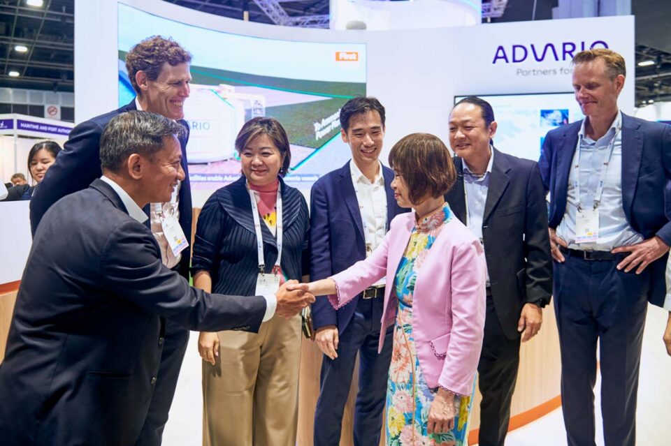 Delegates greeting each other at the Advario stand during Singapore Maritime Week — singapore corporate events photographer, professional corporate events photography singapore
