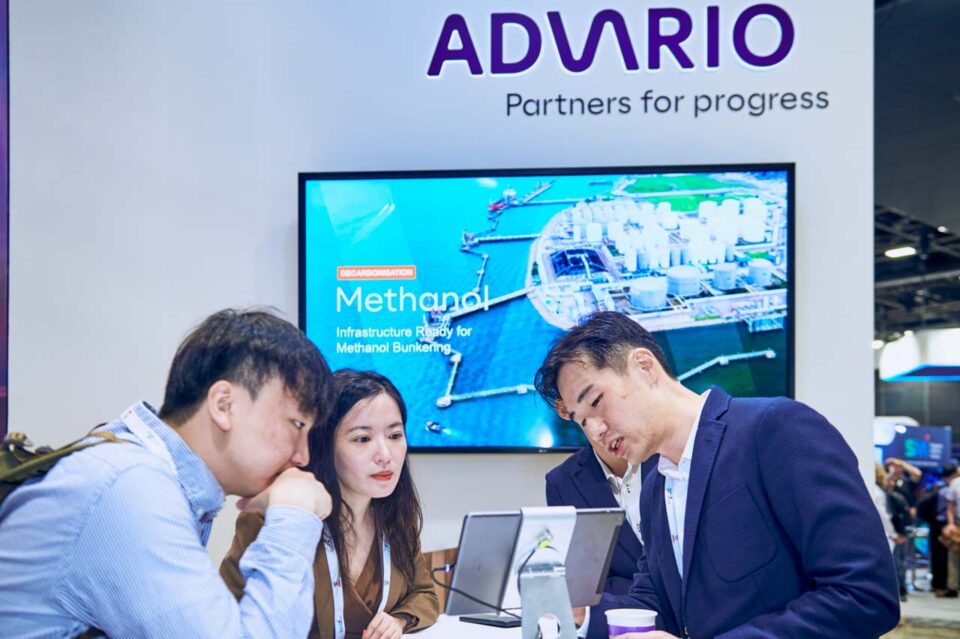 Delegates seated in conversation at the Advario stand during Singapore Maritime Week — singapore corporate events photographer, professional corporate events photography singapore