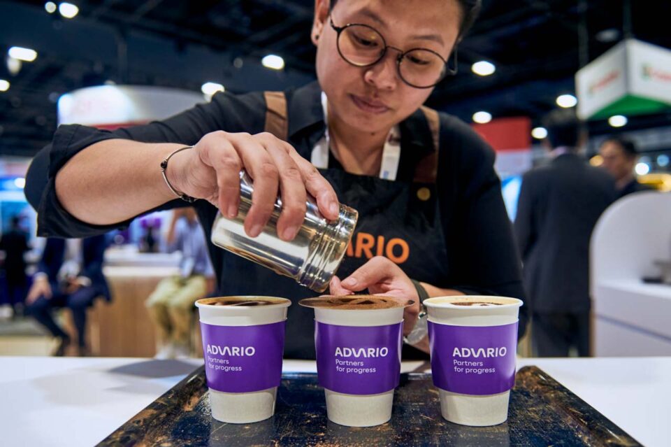 Barista preparing branded drinks at the Advario stand during Singapore Maritime Week — singapore corporate events photographer, professional corporate events photography singapore