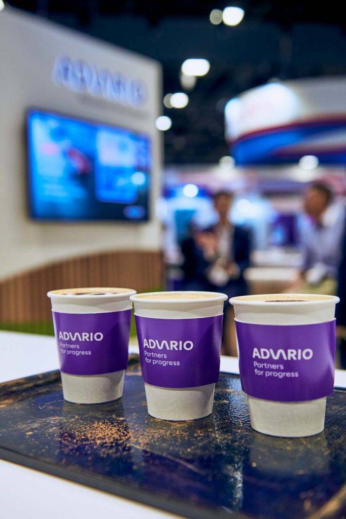 Row of branded Advario coffee cups on the counter at Singapore Maritime Week — singapore corporate events photographer, professional corporate events photography singapore