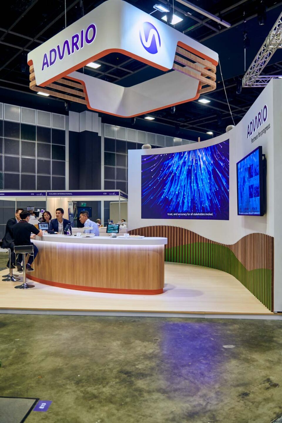 Illuminated blue graphic display screen at the Advario stand during Singapore Maritime Week — singapore commercial photographer, corporate photographer singapore