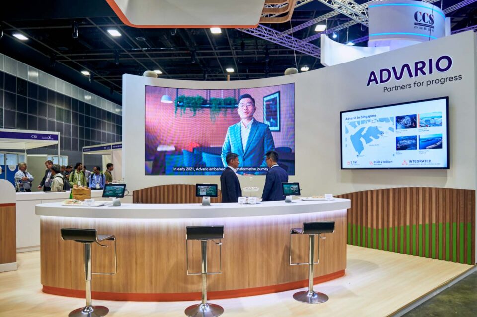 Delegates watching a presentation on the stand screen at Singapore Maritime Week — singapore corporate events photographer, professional corporate events photography singapore