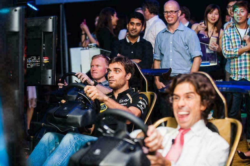 Guests trying a racing simulator at the 2012 Clear F1 event in Singapore — singapore corporate events photographer, professional corporate events photography singapore