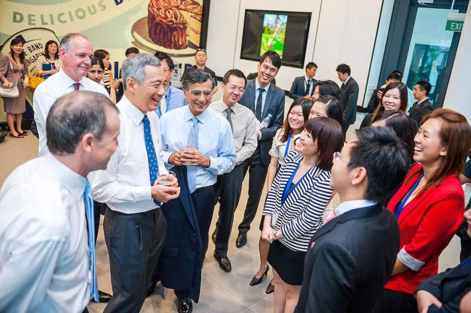 Guests networking at the Unilever Four Acres Singapore official opening in 2013 — singapore corporate events photographer, professional corporate events photography singapore