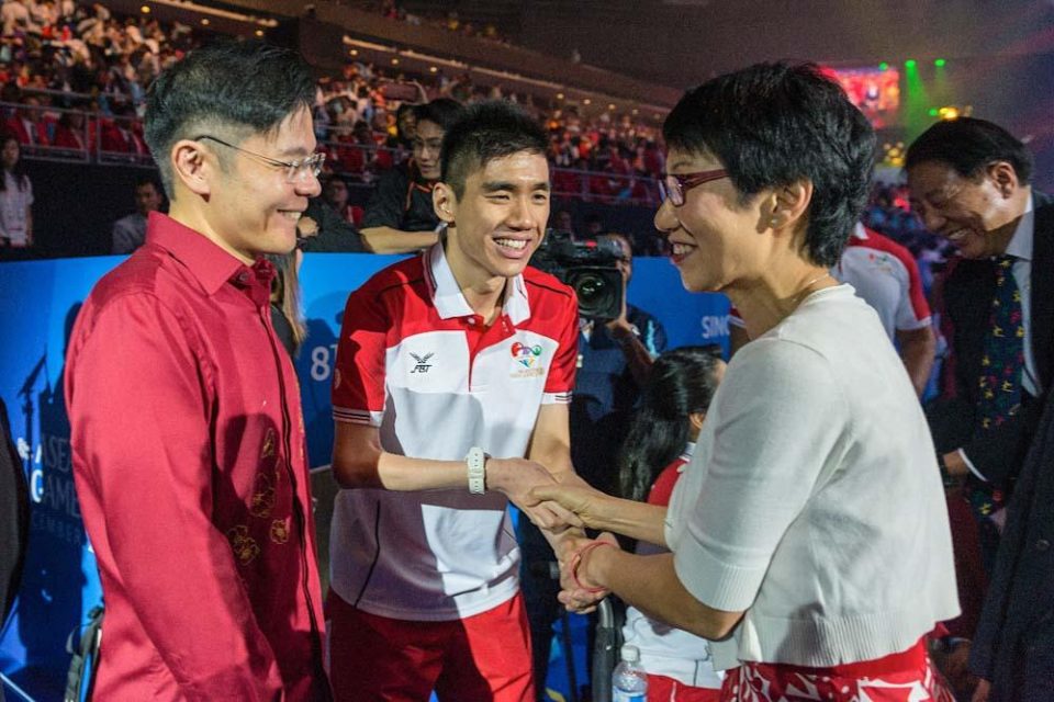 Athletes greeting each other at the opening ceremony of the 2015 ASEAN Para Games — singapore corporate events photographer, corporate event photographer singapore