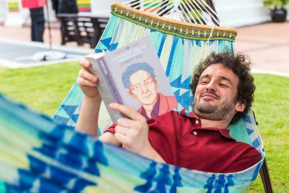 Writer holding a book up to camera at the Textures 2018 literary festival — singapore commercial photographer, corporate photographer singapore