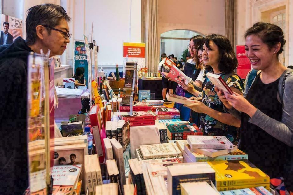 Visitors browsing a bookstall at the Textures 2018 literary festival — singapore corporate events photographer, professional corporate events photography singapore