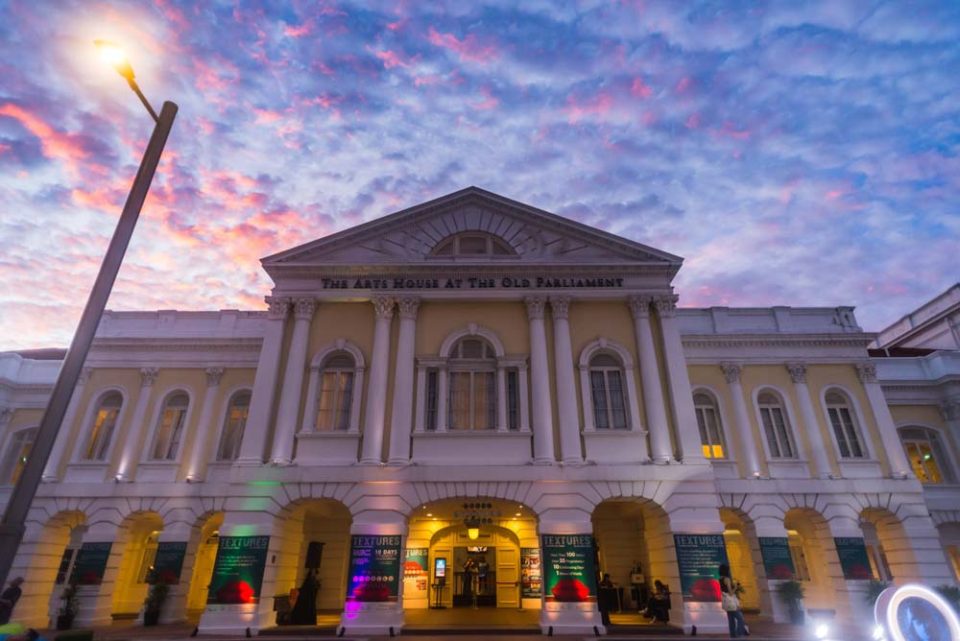 The Arts House at dusk during Textures 2020, its colonnaded facade lit against a pink sky — singapore commercial photographer, corporate photographer singapore