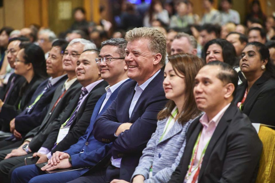Front row of delegates seated and listening during a session at the IAPP Asia Privacy Forum 2023 — singapore corporate events photographer