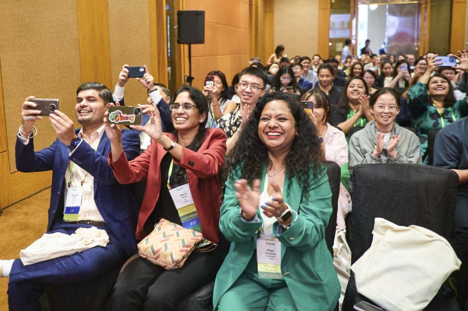 Delegates photographing the stage on their phones during a session at the IAPP Asia Privacy Forum 2023 — singapore corporate events photographer
