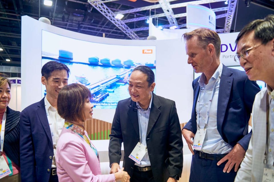 Delegates in conversation at the Advario stand during Singapore Maritime Week 2024 — singapore corporate events photographer, professional corporate events photography singapore