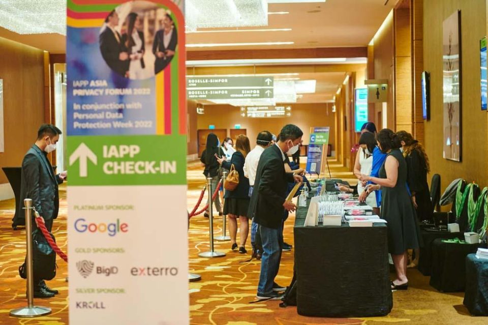 Registration and check-in desk at the IAPP Asia Privacy Forum with sponsor signage — singapore corporate events photographer, professional corporate events photography singapore