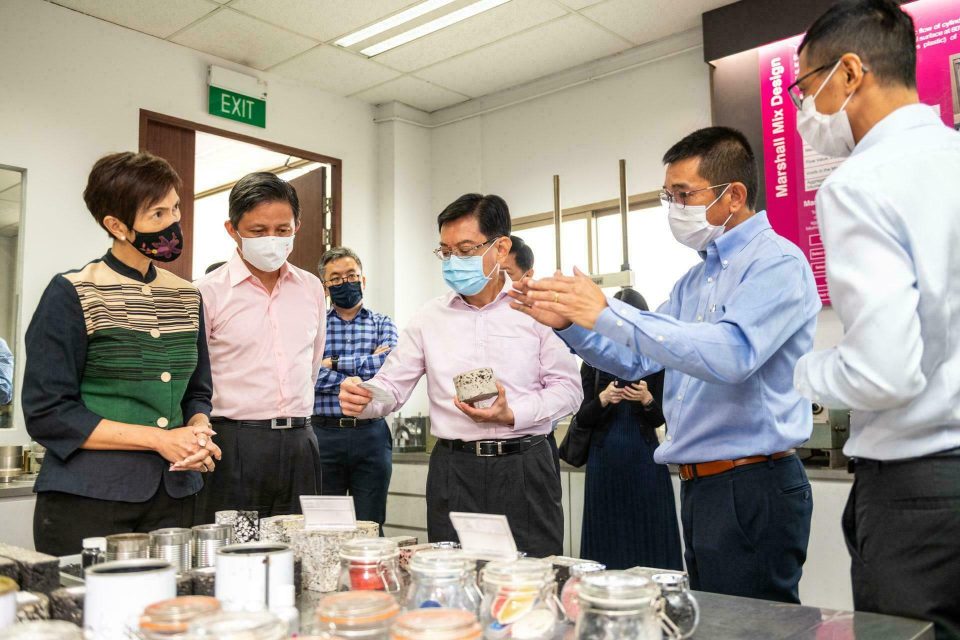 Masked guests and staff at a Samwoh product stand during a 2020 Singapore corporate event — singapore corporate events photographer, professional corporate events photography singapore