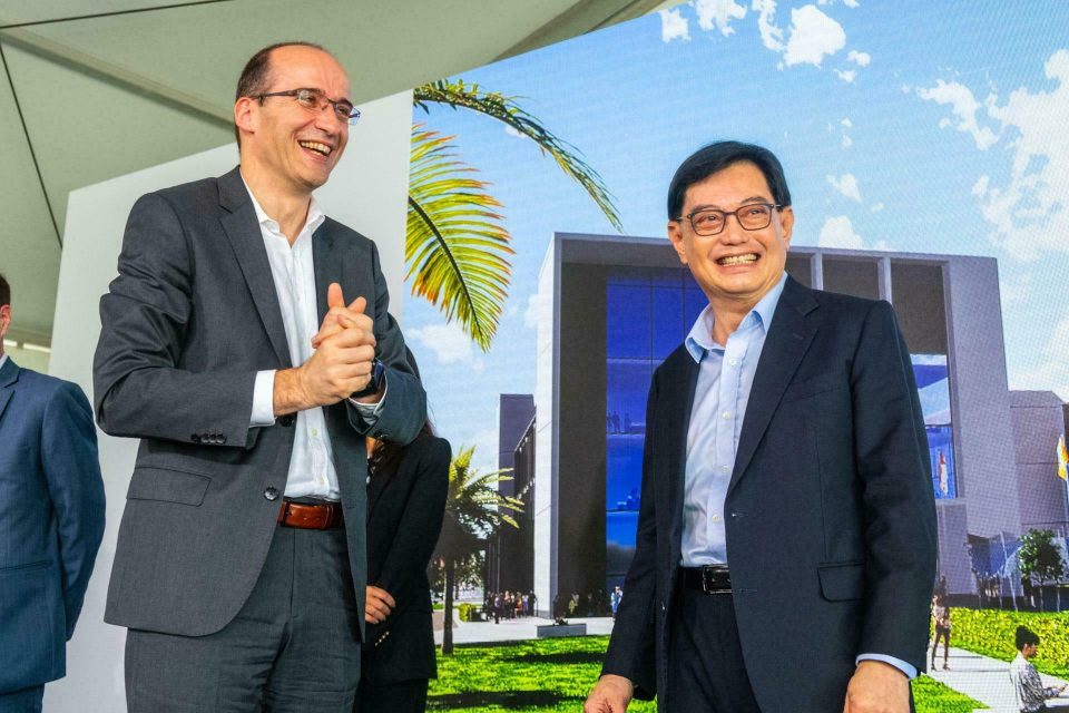 Executives applauding outdoors against greenery at a Sanofi event in Singapore — singapore corporate events photographer, professional corporate events photography singapore